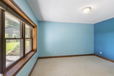 Custom-designed cedar home on over 7.5 acres with 600' of on Bear Lake Highlands Golf Course in Michigan - for sale on GolfHomes.com, golf home, golf lot