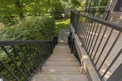 Custom-designed cedar home on over 7.5 acres with 600' of on Bear Lake Highlands Golf Course in Michigan - for sale on GolfHomes.com, golf home, golf lot