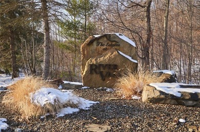 Set on 2.25 wooded acres within the established River Valley on Valleaire Golf Club in Ohio - for sale on GolfHomes.com, golf home, golf lot