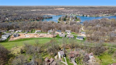 Nestled in the picturesque Lake Doster community This 2 story on Lake Doster Golf Club in Michigan - for sale on GolfHomes.com, golf home, golf lot