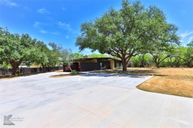 Mid-century modern commercial office on large lot. Located near on Abilene Country Club - South Course in Texas - for sale on GolfHomes.com, golf home, golf lot