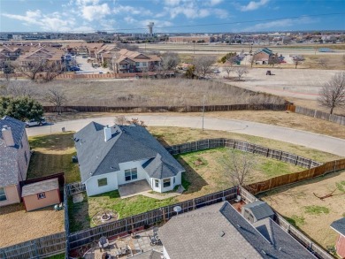 This light and bright corner lot home has been updated to offer on Mansfield National Golf Club in Texas - for sale on GolfHomes.com, golf home, golf lot