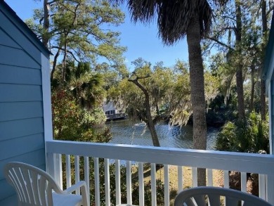 Highly sought-after end unit 2 story townhome overlooking scenic on The Plantation Course At Edisto in South Carolina - for sale on GolfHomes.com, golf home, golf lot