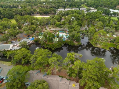 Highly sought-after end unit 2 story townhome overlooking scenic on The Plantation Course At Edisto in South Carolina - for sale on GolfHomes.com, golf home, golf lot