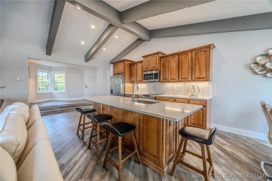 This exceptional 2 bedroom, 2 bath condo has been thoughtfully on Seasons Ridge At Four Seasons in Missouri - for sale on GolfHomes.com, golf home, golf lot