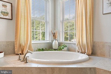 Enjoy main level living in the sought after Dominion Valley on Dominion Valley Country Club in Virginia - for sale on GolfHomes.com, golf home, golf lot