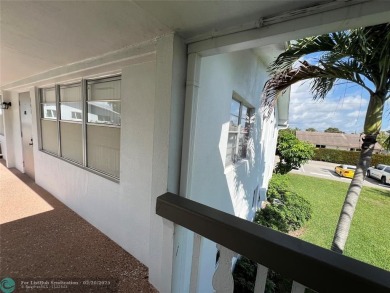 Come see it now! Corner  2nd floor 1 br/1.5 bth with CENTRAL A/C on Hillsboro Pines Golf in Florida - for sale on GolfHomes.com, golf home, golf lot