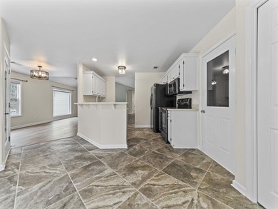 Enjoy Village living in this move-in ready home ideally located on Ponce De Leon Golf Course in Arkansas - for sale on GolfHomes.com, golf home, golf lot