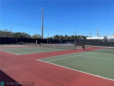 Come see it now! Corner  2nd floor 1 br/1.5 bth with CENTRAL A/C on Hillsboro Pines Golf in Florida - for sale on GolfHomes.com, golf home, golf lot