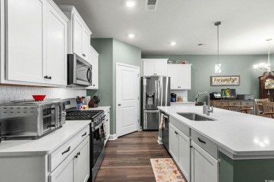 This thoughtfully designed home in The Retreat at Wild Wing on Wild Wing Plantation in South Carolina - for sale on GolfHomes.com, golf home, golf lot