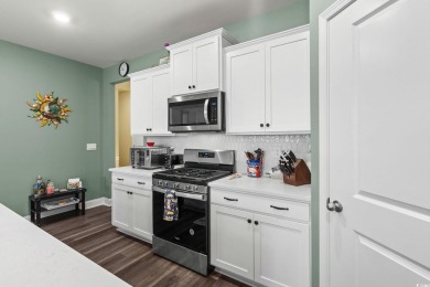 This thoughtfully designed home in The Retreat at Wild Wing on Wild Wing Plantation in South Carolina - for sale on GolfHomes.com, golf home, golf lot