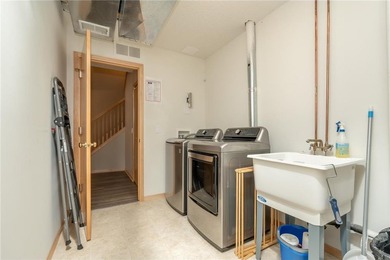 Settle into this beautifully maintained 3-bed, 2-bath townhome on Loggers Trail Golf Club in Minnesota - for sale on GolfHomes.com, golf home, golf lot