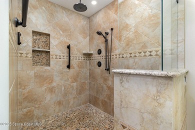 Nestled within a sought-after resort-style country club on Indian River Colony Club in Florida - for sale on GolfHomes.com, golf home, golf lot