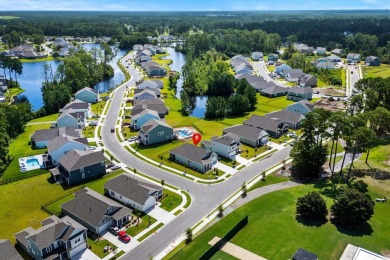 This thoughtfully designed home in The Retreat at Wild Wing on Wild Wing Plantation in South Carolina - for sale on GolfHomes.com, golf home, golf lot