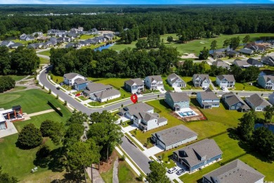 This thoughtfully designed home in The Retreat at Wild Wing on Wild Wing Plantation in South Carolina - for sale on GolfHomes.com, golf home, golf lot