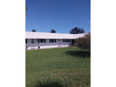 This 2/2 villa sits directly on the golf course which is free to on Leisureville Community Golf Course in Florida - for sale on GolfHomes.com, golf home, golf lot