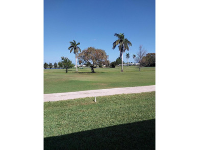 This 2/2 villa sits directly on the golf course which is free to on Leisureville Community Golf Course in Florida - for sale on GolfHomes.com, golf home, golf lot
