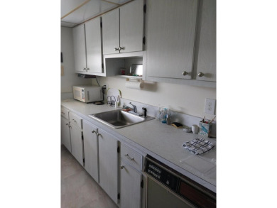 This 2/2 villa sits directly on the golf course which is free to on Leisureville Community Golf Course in Florida - for sale on GolfHomes.com, golf home, golf lot