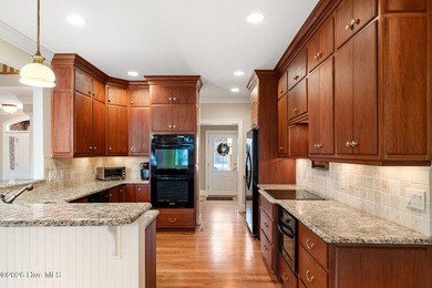 Custom-crafted and impeccably maintained, this stunning golf on River Landing Golf Course in North Carolina - for sale on GolfHomes.com, golf home, golf lot