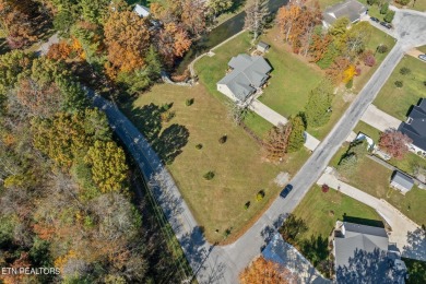 Welcome to your lakeside sanctuary on Lake Tansi's shores, a on Lake Tansi Village Country Club in Tennessee - for sale on GolfHomes.com, golf home, golf lot