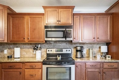 Spectacular 2-bed, 2-bath residence with gorgeous lake and on Diamondhead Golf and Country Club in Arkansas - for sale on GolfHomes.com, golf home, golf lot