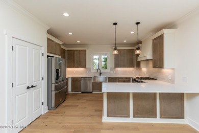 Welcome to your dream home in the premier lake and golf on Beacon Ridge Golf and Country Club in North Carolina - for sale on GolfHomes.com, golf home, golf lot