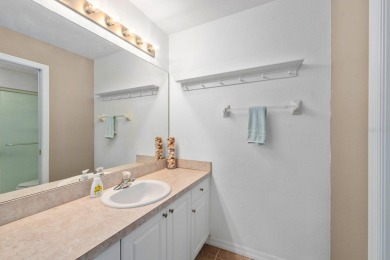 Welcome to this beautifully maintained 2-bedroom, 2-bathroom on Sabal Trace Golf and Country Club in Florida - for sale on GolfHomes.com, golf home, golf lot