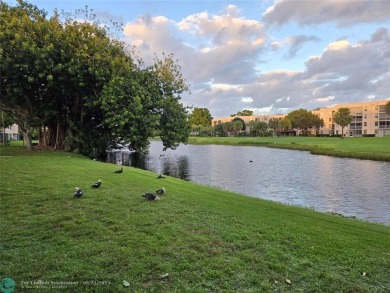 LOCATION,LOCATION, BEAUTIFUL TWO BEDROOM TWO BATH OVERLOOKING on Pine Island Ridge Country Club in Florida - for sale on GolfHomes.com, golf home, golf lot