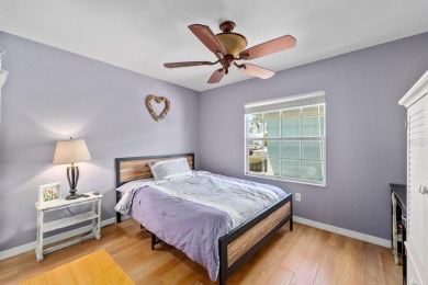 Welcome to this beautifully maintained 2-bedroom, 2-bathroom on Sabal Trace Golf and Country Club in Florida - for sale on GolfHomes.com, golf home, golf lot