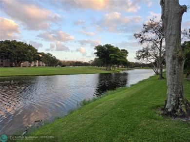 LOCATION,LOCATION, BEAUTIFUL TWO BEDROOM TWO BATH OVERLOOKING on Pine Island Ridge Country Club in Florida - for sale on GolfHomes.com, golf home, golf lot