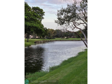 LOCATION,LOCATION, BEAUTIFUL TWO BEDROOM TWO BATH OVERLOOKING on Pine Island Ridge Country Club in Florida - for sale on GolfHomes.com, golf home, golf lot