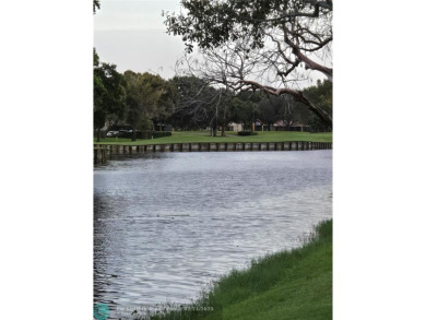 LOCATION,LOCATION, BEAUTIFUL TWO BEDROOM TWO BATH OVERLOOKING on Pine Island Ridge Country Club in Florida - for sale on GolfHomes.com, golf home, golf lot