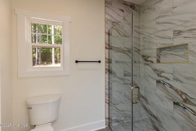 Welcome to your dream home in the premier lake and golf on Beacon Ridge Golf and Country Club in North Carolina - for sale on GolfHomes.com, golf home, golf lot