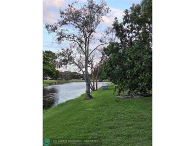 LOCATION,LOCATION, BEAUTIFUL TWO BEDROOM TWO BATH OVERLOOKING on Pine Island Ridge Country Club in Florida - for sale on GolfHomes.com, golf home, golf lot