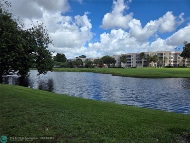 LOCATION,LOCATION, BEAUTIFUL TWO BEDROOM TWO BATH OVERLOOKING on Pine Island Ridge Country Club in Florida - for sale on GolfHomes.com, golf home, golf lot