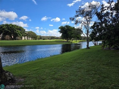 LOCATION,LOCATION, BEAUTIFUL TWO BEDROOM TWO BATH OVERLOOKING on Pine Island Ridge Country Club in Florida - for sale on GolfHomes.com, golf home, golf lot