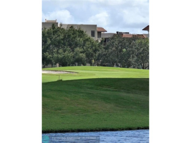 LOCATION,LOCATION, BEAUTIFUL TWO BEDROOM TWO BATH OVERLOOKING on Pine Island Ridge Country Club in Florida - for sale on GolfHomes.com, golf home, golf lot