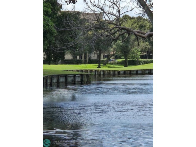 LOCATION,LOCATION, BEAUTIFUL TWO BEDROOM TWO BATH OVERLOOKING on Pine Island Ridge Country Club in Florida - for sale on GolfHomes.com, golf home, golf lot