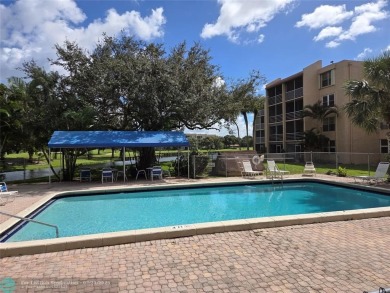 LOCATION,LOCATION, BEAUTIFUL TWO BEDROOM TWO BATH OVERLOOKING on Pine Island Ridge Country Club in Florida - for sale on GolfHomes.com, golf home, golf lot