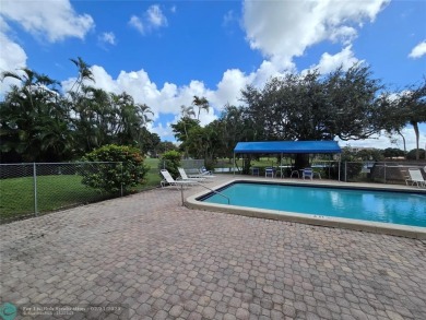 LOCATION,LOCATION, BEAUTIFUL TWO BEDROOM TWO BATH OVERLOOKING on Pine Island Ridge Country Club in Florida - for sale on GolfHomes.com, golf home, golf lot