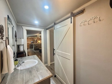 This stunning 2-bedroom, 2-bath partially furnished manufactured on Pendleton Harbor in Texas - for sale on GolfHomes.com, golf home, golf lot