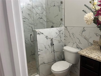 PRICE JUST REDUCED! Welcome to an impeccably maintained modern on Babe Zaharias Golf Course in Florida - for sale on GolfHomes.com, golf home, golf lot