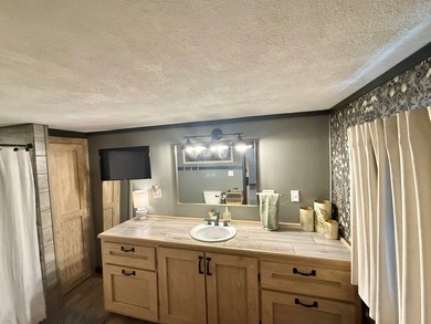 This stunning 2-bedroom, 2-bath partially furnished manufactured on Pendleton Harbor in Texas - for sale on GolfHomes.com, golf home, golf lot