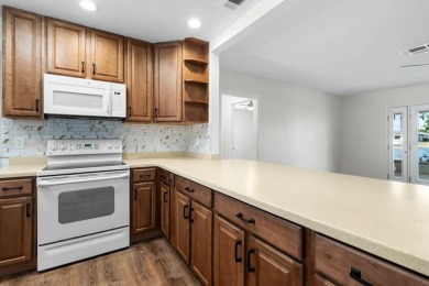 Nestled on a serene cul-de-sac with picturesque lake views, this on Caloosa Greens Executive Golf Course in Florida - for sale on GolfHomes.com, golf home, golf lot