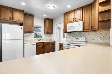 Nestled on a serene cul-de-sac with picturesque lake views, this on Caloosa Greens Executive Golf Course in Florida - for sale on GolfHomes.com, golf home, golf lot