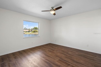 Nestled on a serene cul-de-sac with picturesque lake views, this on Caloosa Greens Executive Golf Course in Florida - for sale on GolfHomes.com, golf home, golf lot