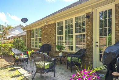 Soaring high ceilings, the inviting openness and hardwood floors on Woodside Plantation Country Club in South Carolina - for sale on GolfHomes.com, golf home, golf lot