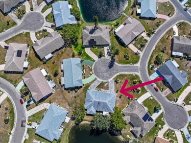 Nestled on a serene cul-de-sac with picturesque lake views, this on Caloosa Greens Executive Golf Course in Florida - for sale on GolfHomes.com, golf home, golf lot