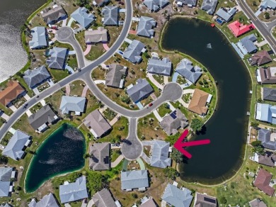 Nestled on a serene cul-de-sac with picturesque lake views, this on Caloosa Greens Executive Golf Course in Florida - for sale on GolfHomes.com, golf home, golf lot