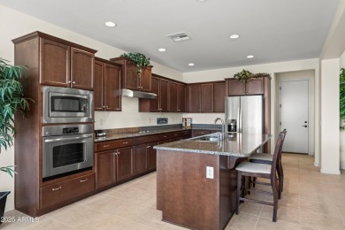 Make this magnificent Treviso model with enchanting water views on Tuscany Falls At Pebble Creek in Arizona - for sale on GolfHomes.com, golf home, golf lot